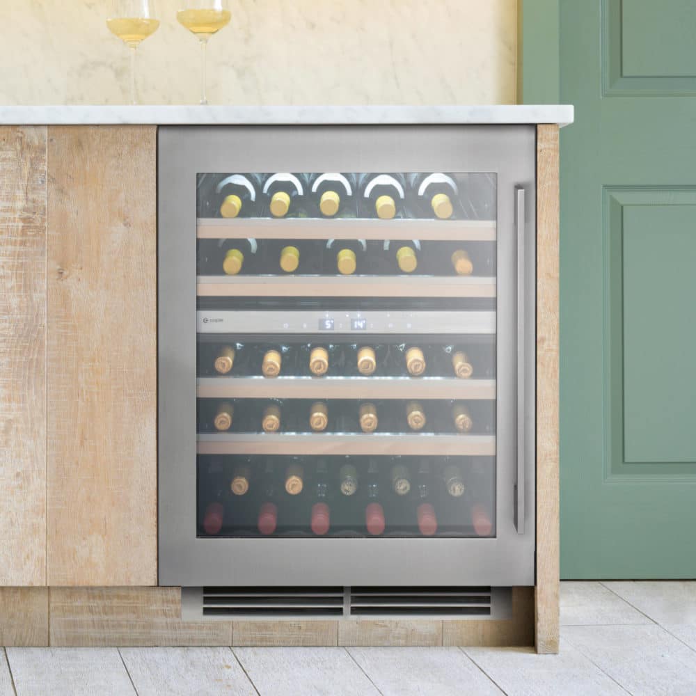 Premium Stainless Steel 60cm Wine Cooler with wine bottles and glasses in green and wood kitchen