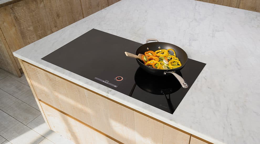Full service induction hob in wood kitchen