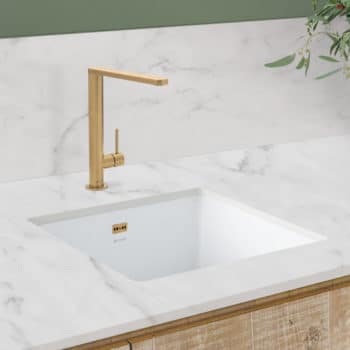 Ceramic sink with gold single control tap
