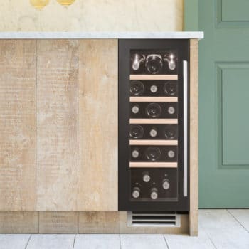 30cm Wine Cooler Single Zone in Black Glass in a green and wood kitchen